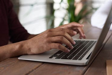 Podcast Person Using Macbook